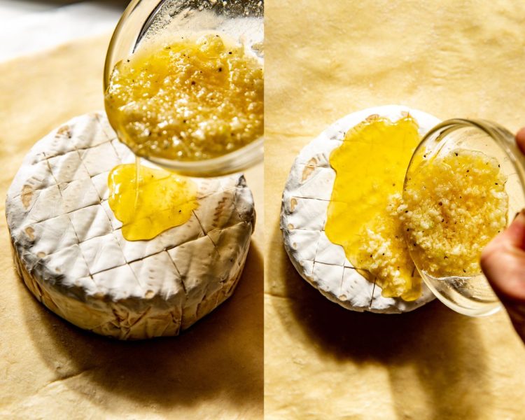 Side by side images of a wheel of brie cheese atop puff pastry dough, with a melted butter and garlic mixture being poured on top.