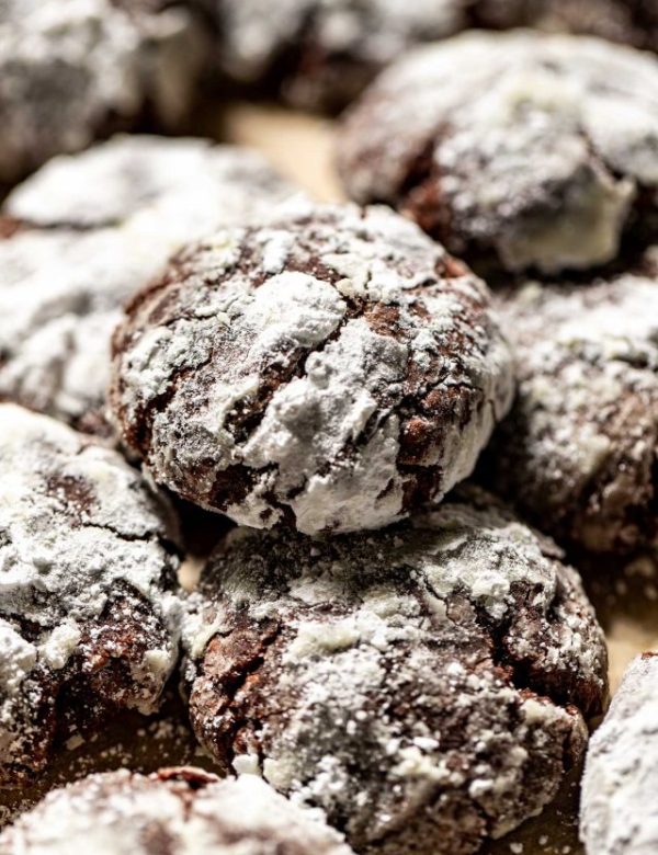 close up of several chocolate crinkle cookies.