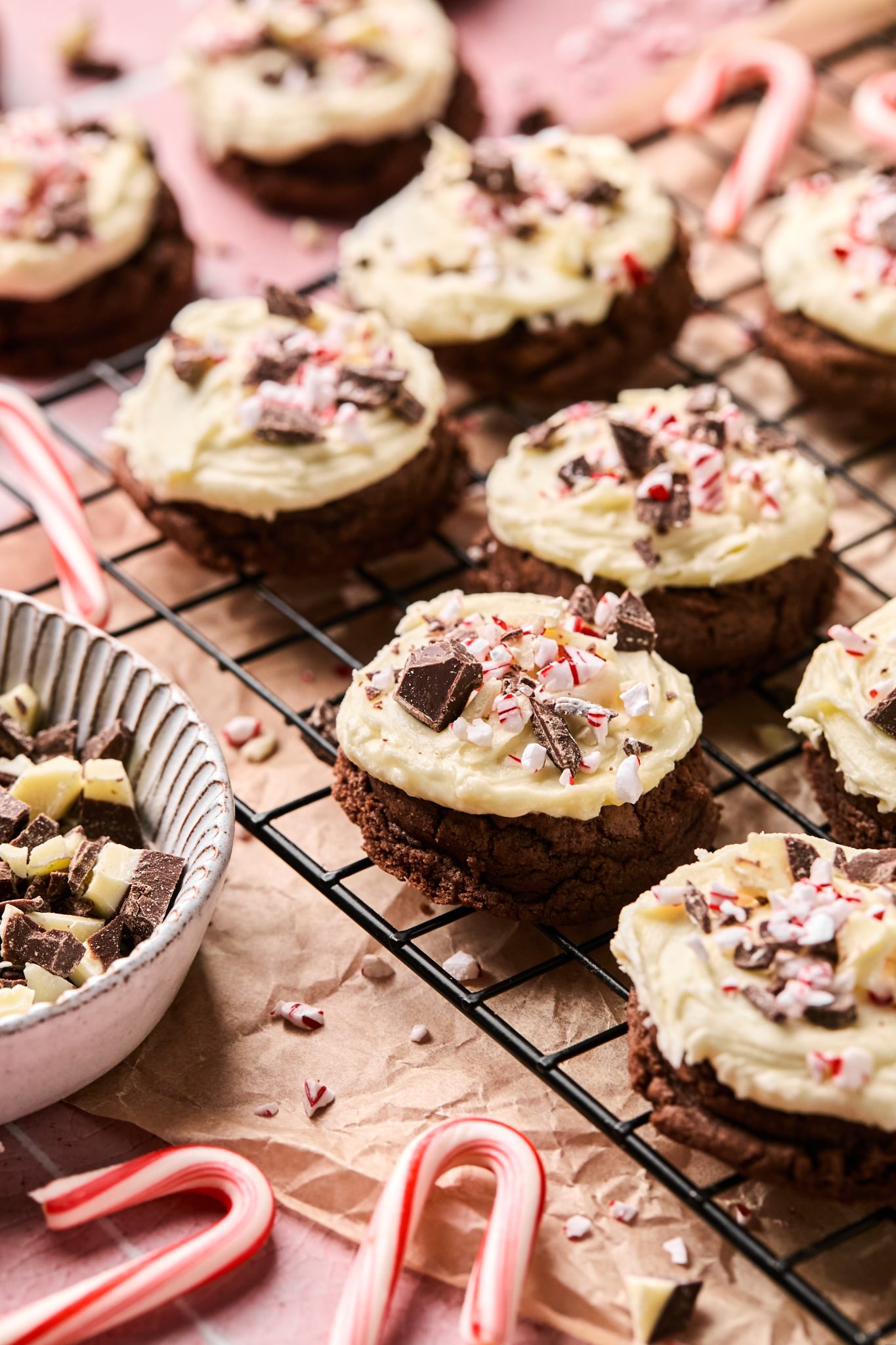 peppermint bark cookies on a black cooling rack. 