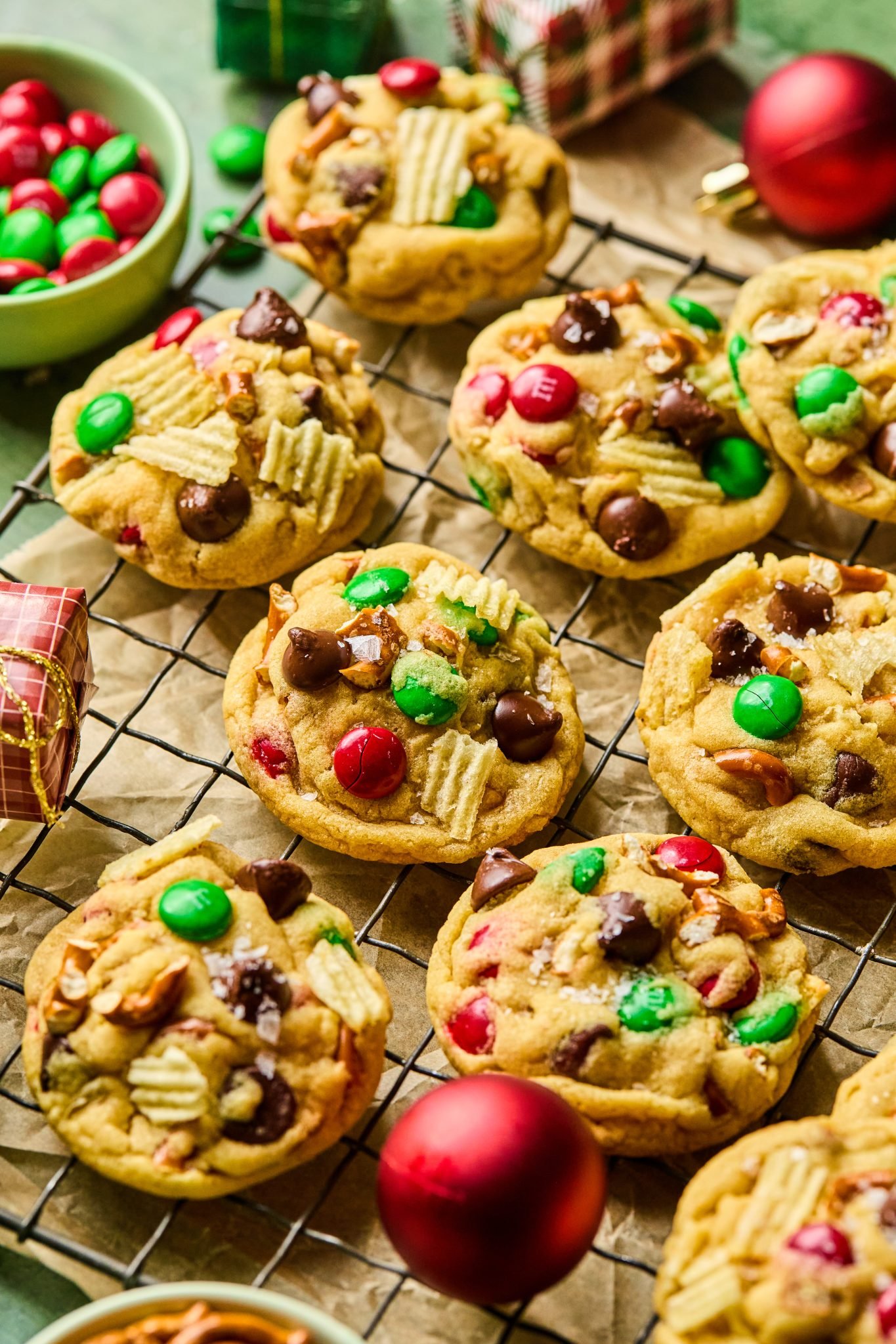 santas trash cookies on a black cooling rack. 