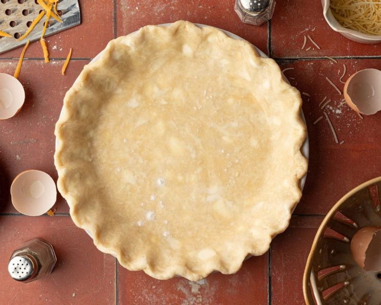 Unbaked pie crust in a pie pan.