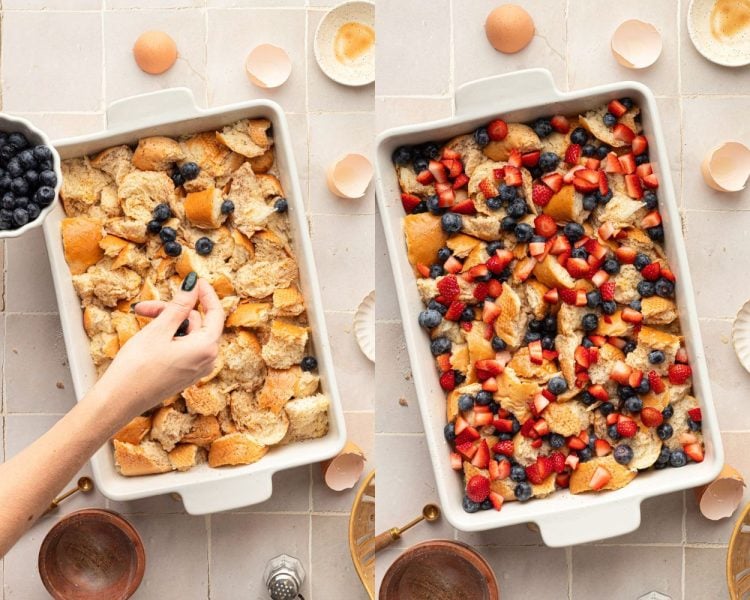 Side by side images of a white casserole dish. Left image shows dish full of pieces of bread with hands adding blueberries on top. Right side shows the same dish full of torn pieces of bread, cut strawberry pieces, and blueberries.