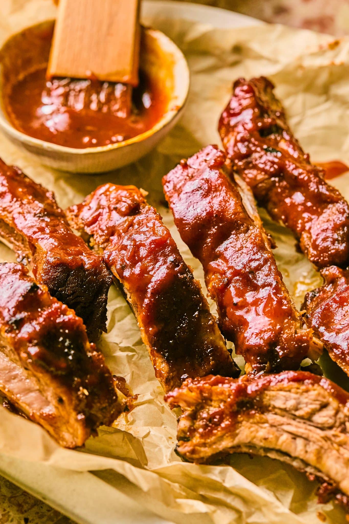 a close up image of slow cooker pork ribs. 