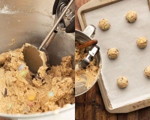 A cookie scoop is being used to portion out the cookie dough onto a parchment-lined baking sheet.