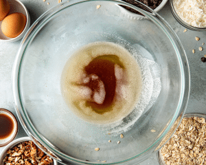 Melted brown butter in glass mixing bowl.