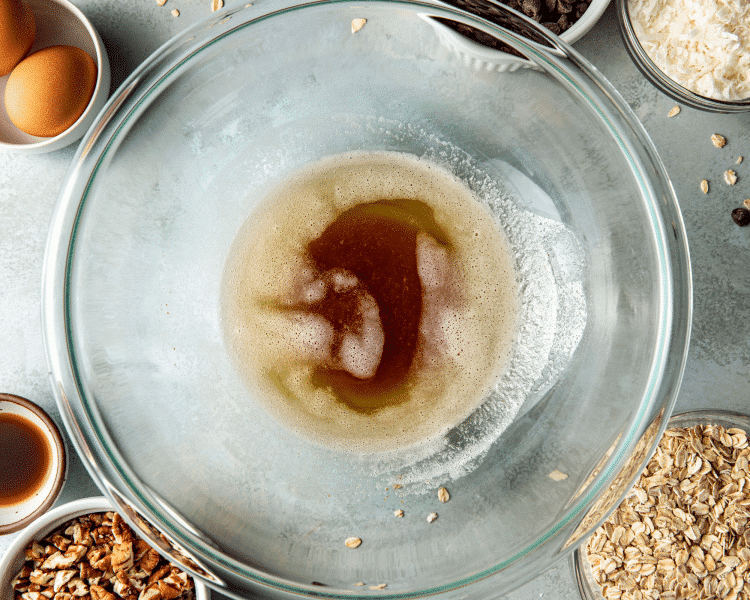 Melted brown butter in glass mixing bowl.