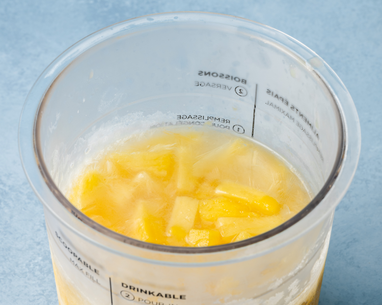 Pineapple chunks in juice frozen in ninja creami pint container.