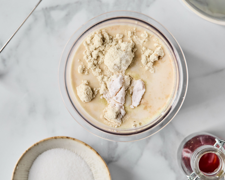 Ingredients added to pint container for vanilla protein ice cream.