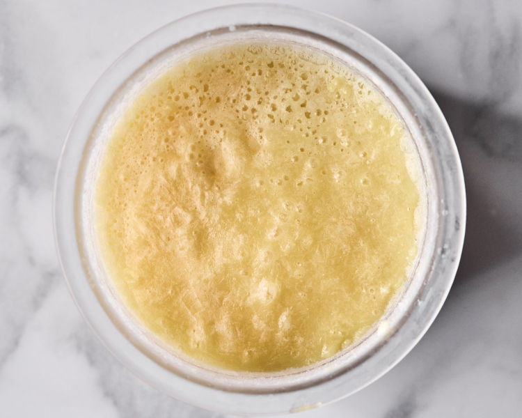 Vanilla protein ice cream frozen in ninja creami pint container after freezing for 24 hours.