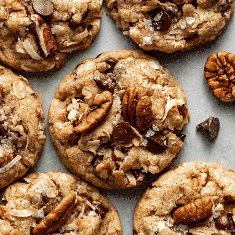 Upclose photo of cowboy cookie topped with pecans, chocolate chips and coconut.