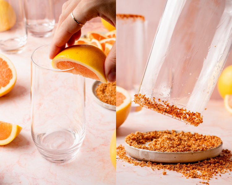 Two-step image of preparing a cocktail glass. Left: a grapefruit wedge rubs the rim of the glass. Right: the glass is dipped into chili-lime salt to coat the rim. Fresh citrus and other glasses appear in the background.