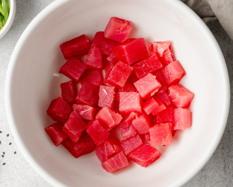 Diced ahi tuna in a large bowl.