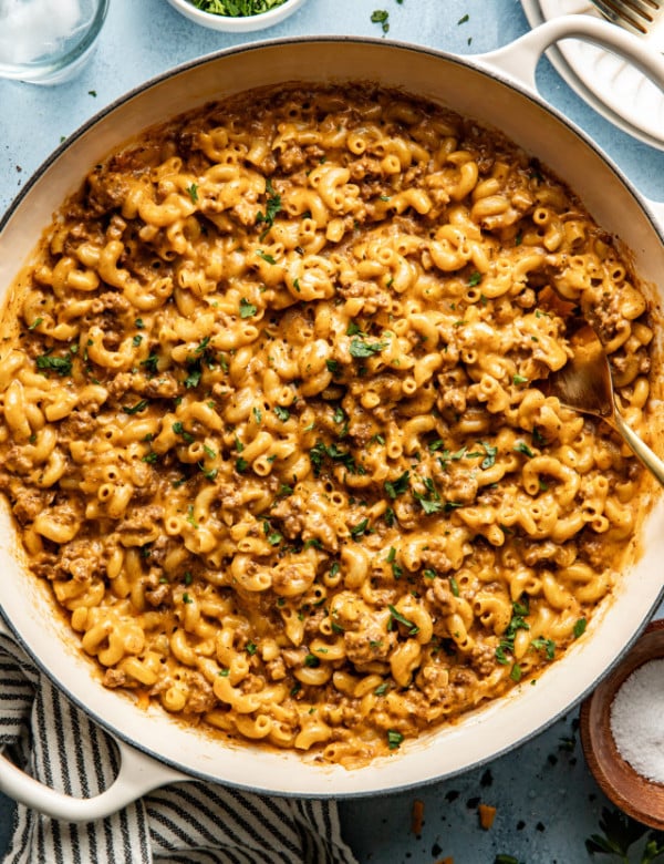 Hamburger macaroni in large pot with fork.
