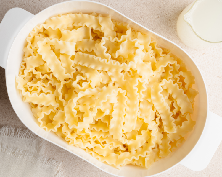 Cooked pasta in strainer.