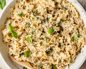 Zucchini lemon pasta in serving bowl with fresh basil.
