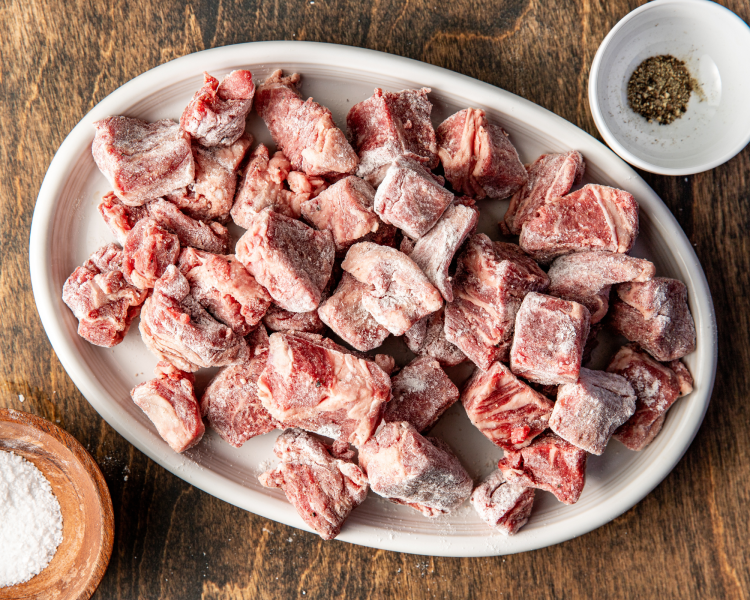 Beef chuck coated in flour.