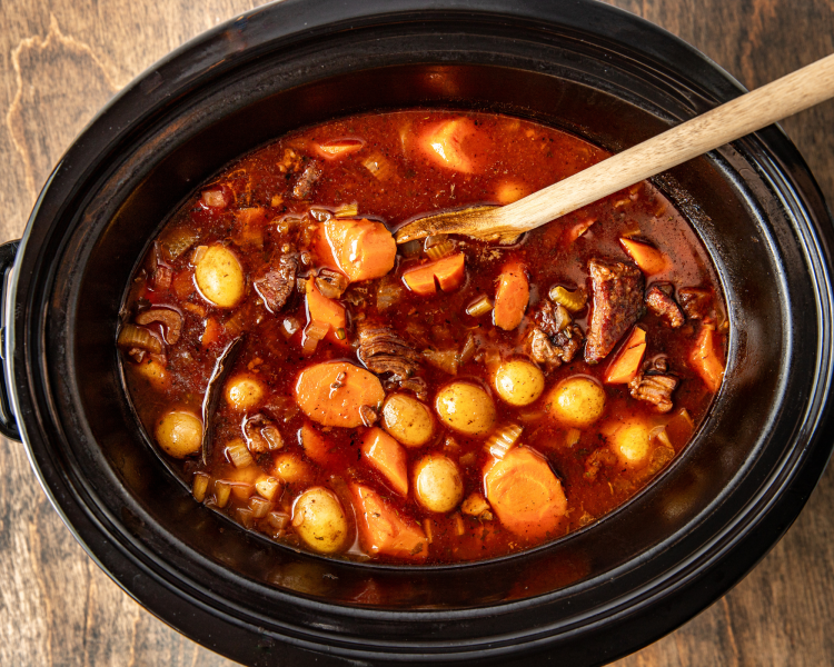 Beef stew after cooking for 8-10 hours before adding the remaining ingredients like frozen peas and cold butter.