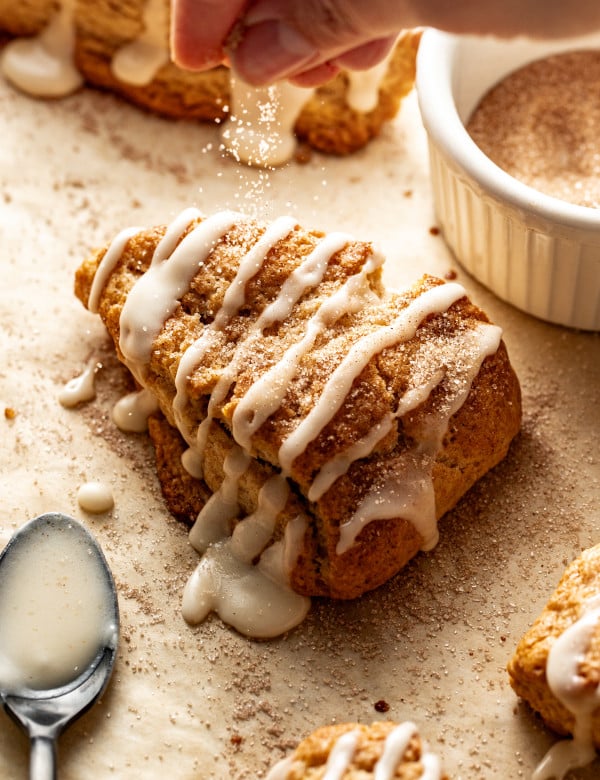 Sprinkle baked scone with cinnamon sugar topping.