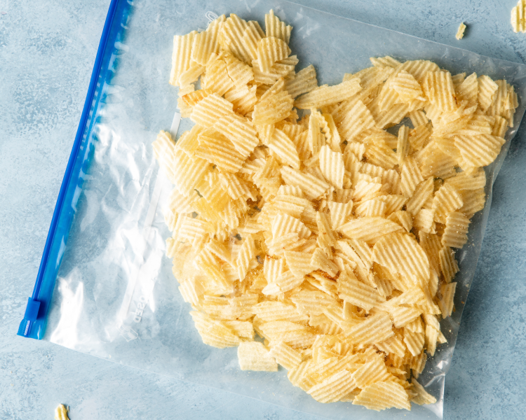 Potato chips in large ziplock bag crushed into small pieces.
