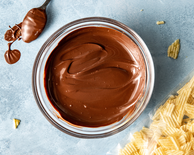 Chocolate melted in glass bowl.