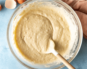 Waffle batter mixed in a bowl that is resting for 10 minutes before cooking.