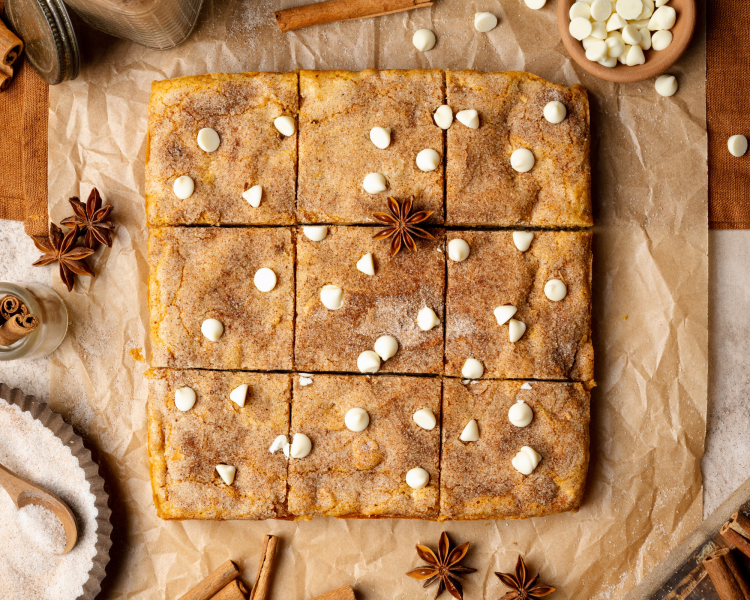 Pumpkin snickerdoodle blondies cooled and cut into 9 squares.