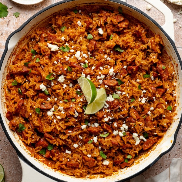 Spanish rice and chorizo recipe baked in skillet.