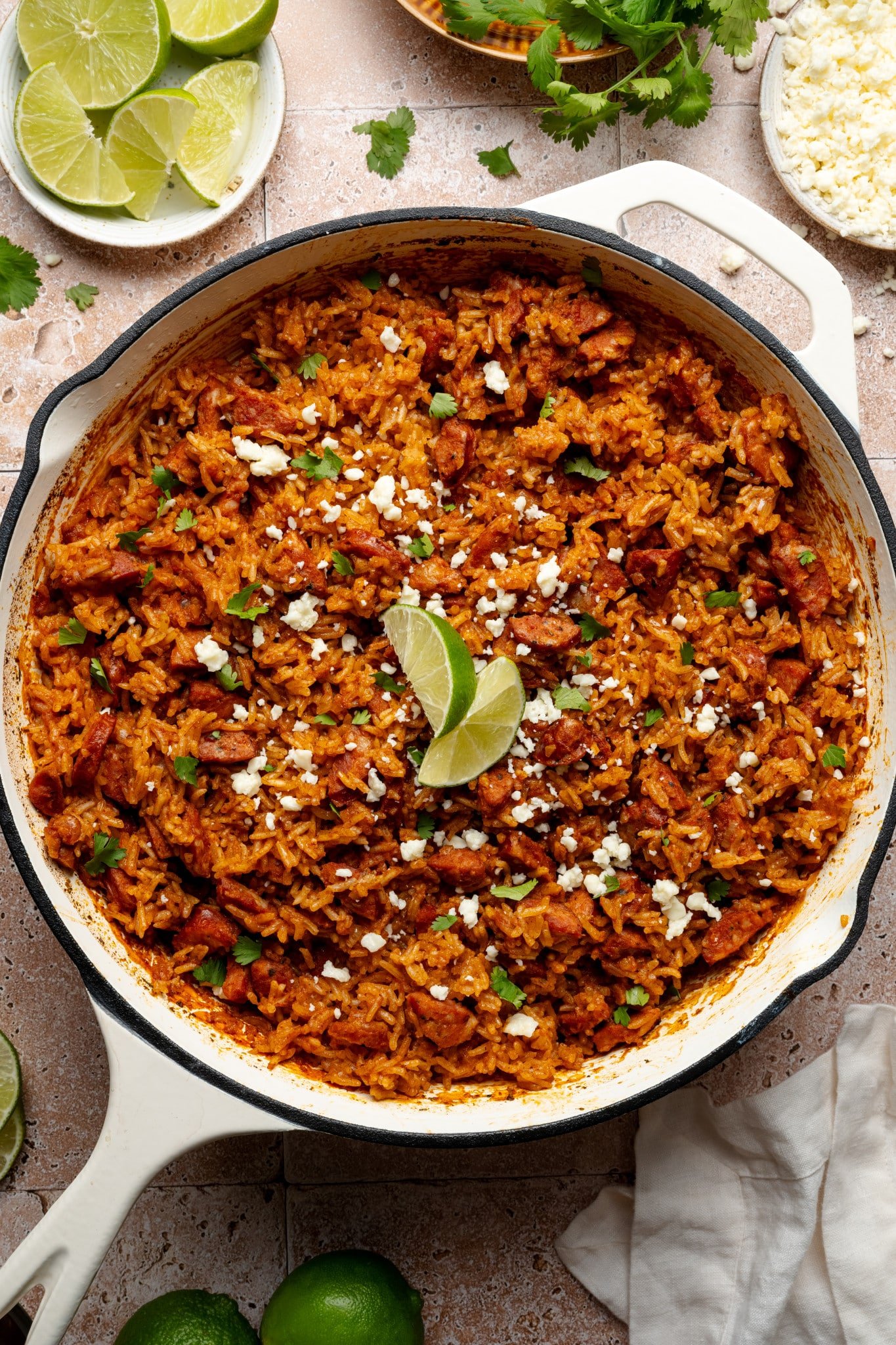 Spanish rice and chorizo recipe baked in skillet.