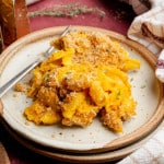 Sweet potato mac and cheese on plate with fork.