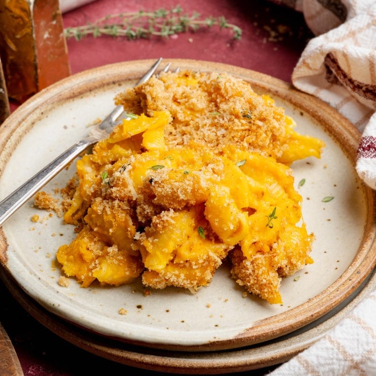 Sweet potato mac and cheese on plate with fork.