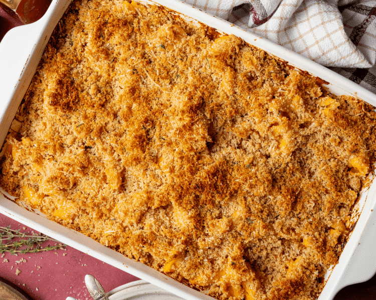 Sweet potato mac and cheese baked in 9x13 baking dish.