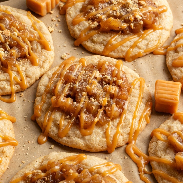 Apple pie cookies drizzled with caramel and coated with graham cracker crumbs.