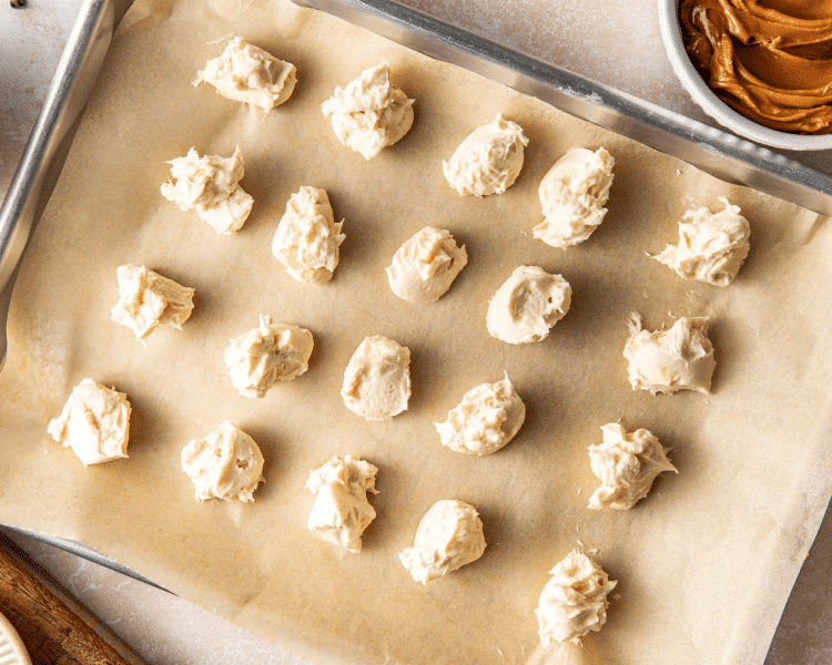 Drops of cheesecake filling frozen for cookie butter cookies.