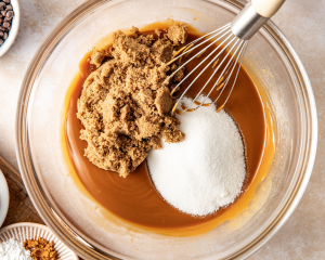 Whisking in the sugars to the melted butters.