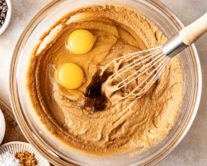 Whisking in the eggs and vanilla to the wet ingredients.