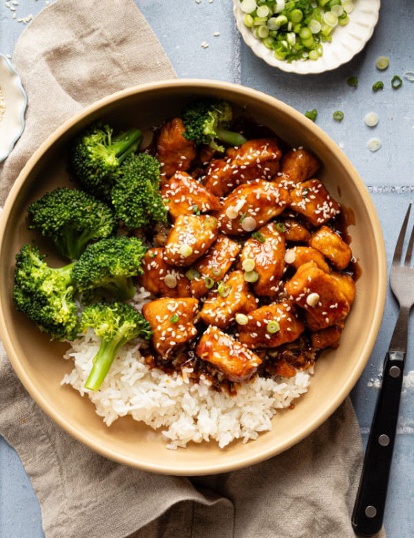 Honey garlic chicken in bowl with rice and broccoli.