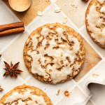 Iced gingerbread oatmeal cookies on table.