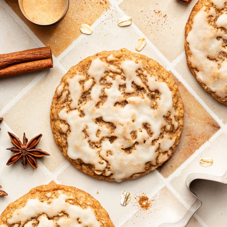 Iced gingerbread oatmeal cookies on table.