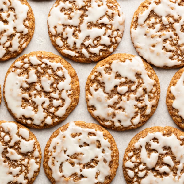 Iced gingerbread oatmeal cookies setting after being iced.