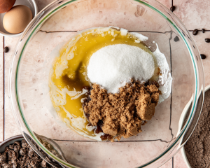 Melted butter and sugars in mixing bowl for espresso cookies.