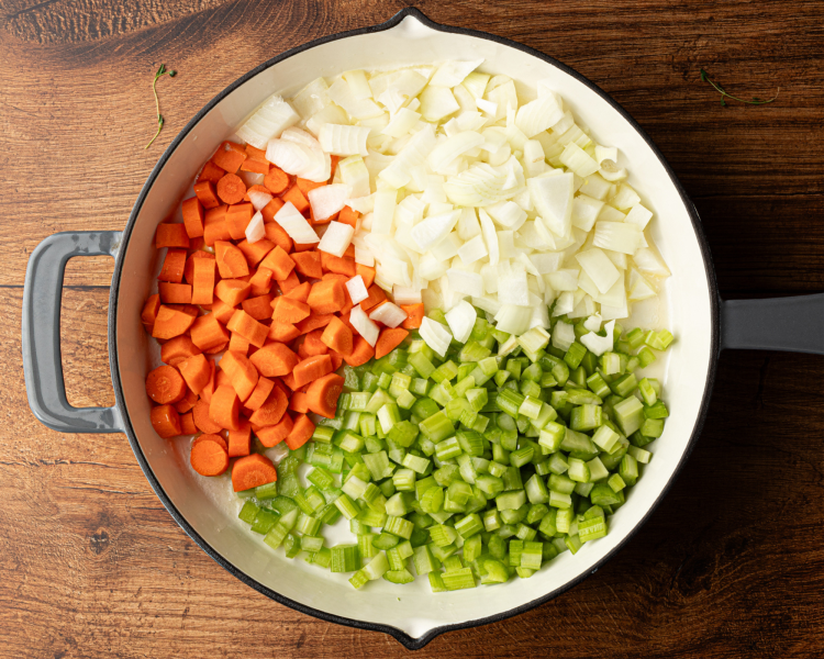 Celery, carrots and onions chopped and placed in large skillet to cook.