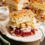 Thanksgiving leftover sliders on white serving dish.