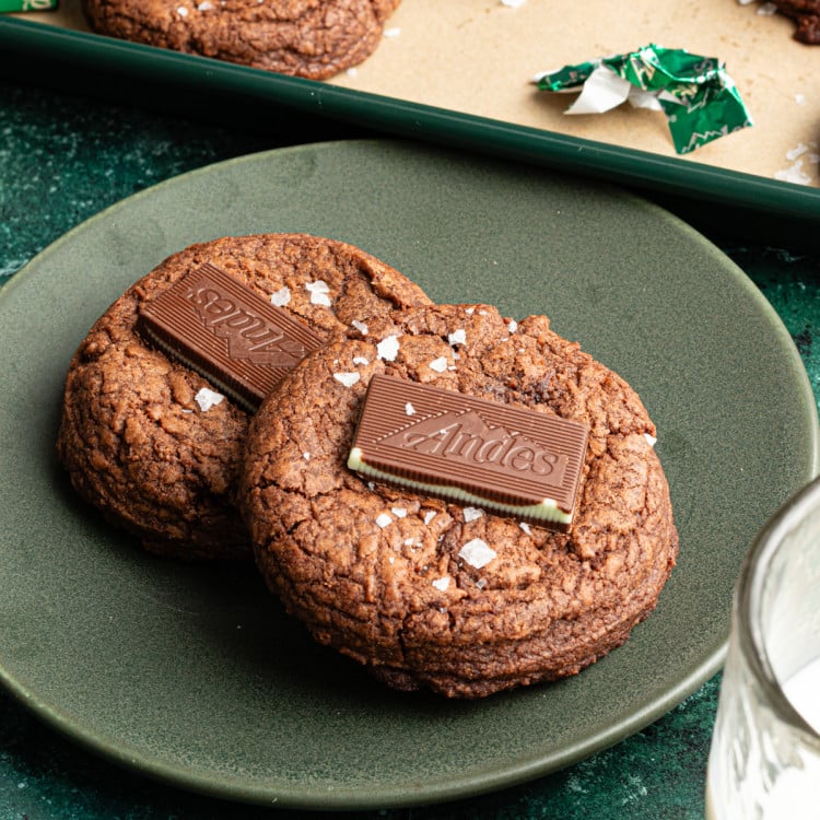 Two Andes chocolate mint cookies on plate.