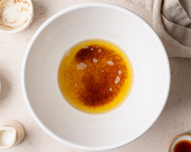 Brown butter poured into mixing bowl to cool for 5-10 minutes.