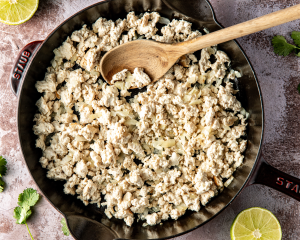 Ground chicken broken up and cooked in cast-iron skillet.