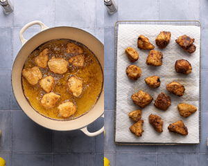 Side-by-side image of frying chicken bites in hot oil then placing on a wire rack with paper towel to soak up excess oil.