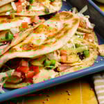 Cheeseburger taco folded over on tray.