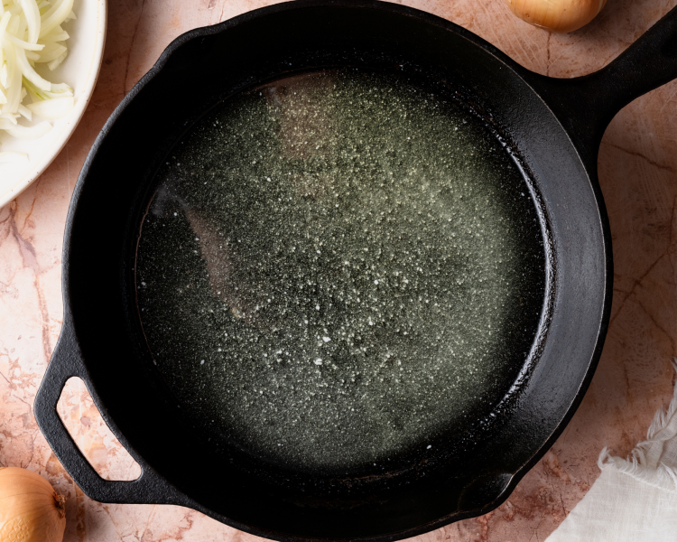 Butter and olive oil added to cast-iron skillet.