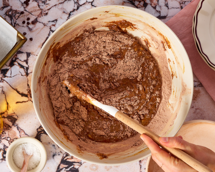 Adding the wet ingredients to the dry ingredients.