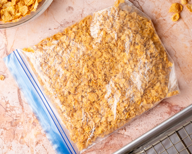 Cornflakes crushed in a large ziplock bag.